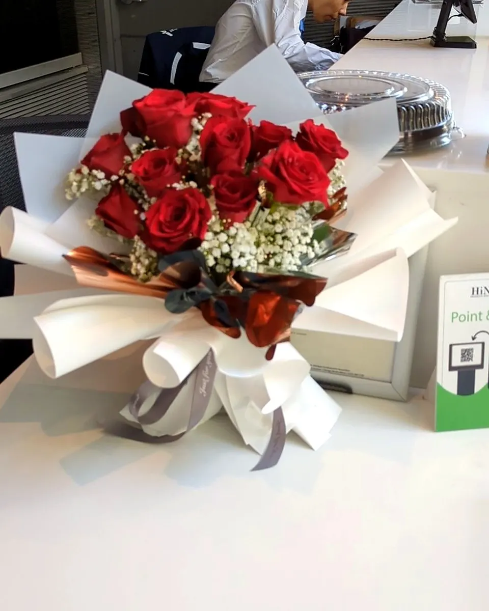 Round red and white rose bouquet with delicate white accents