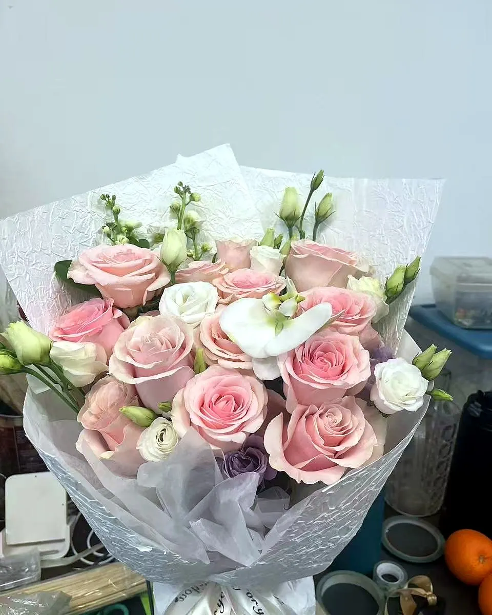 Pink and white rose bouquet with soft foliage