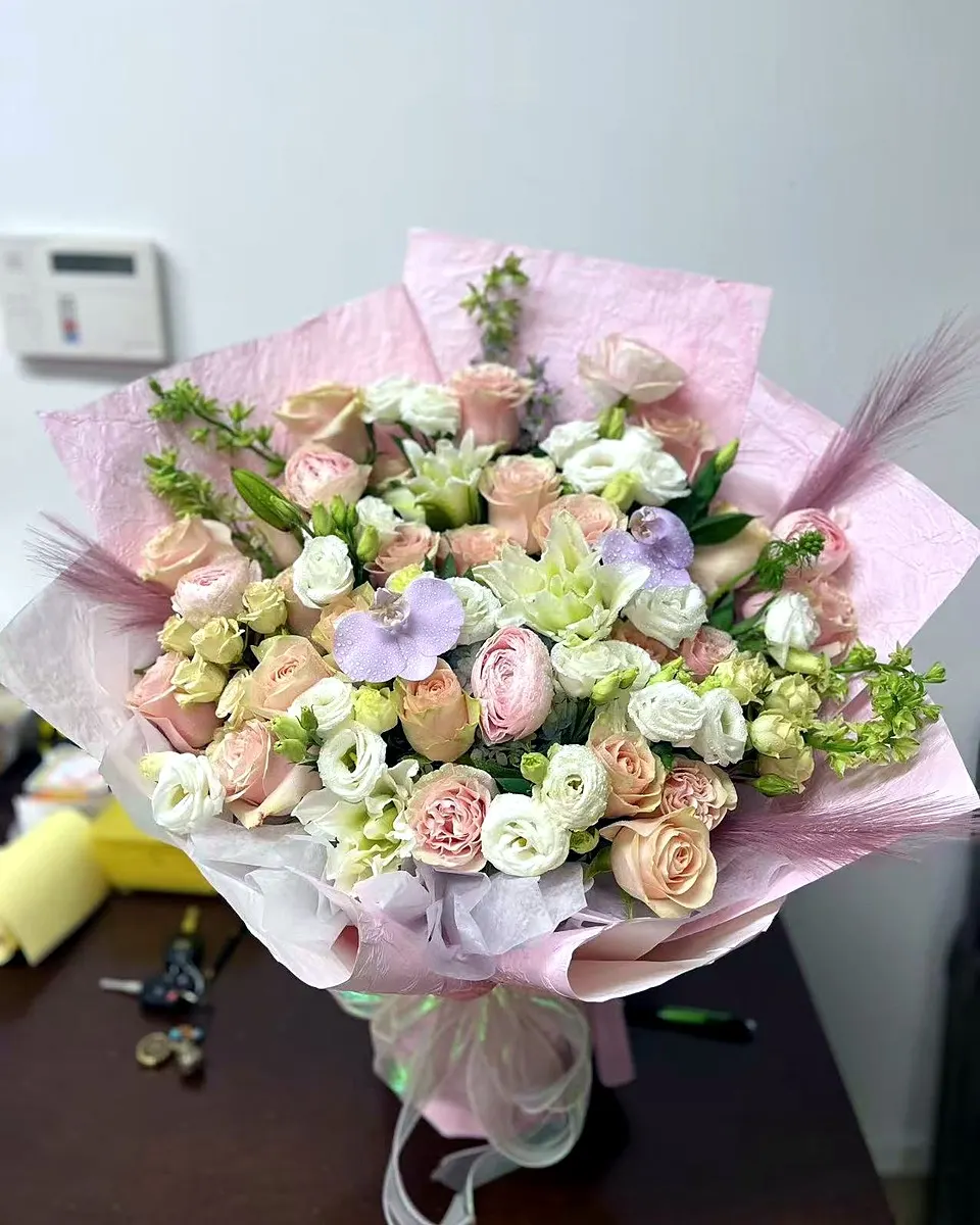 Pastel garden bouquet with pink, cream, and lavender flowers