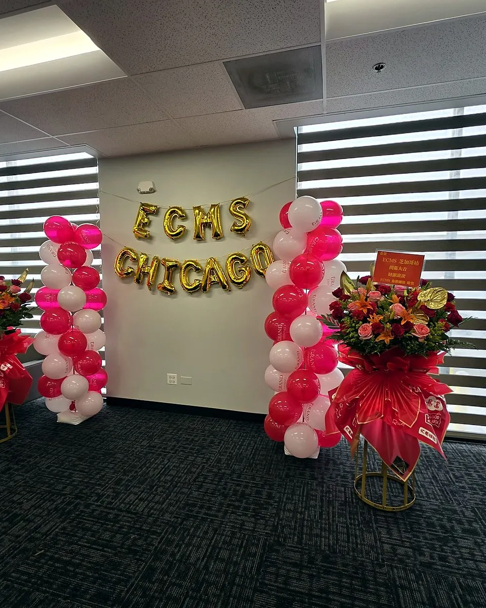 Pink and yellow roses with sunflowers in a grand opening flower stand